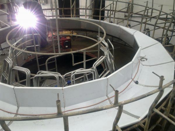 Rotary milking platform under construction with welding flare